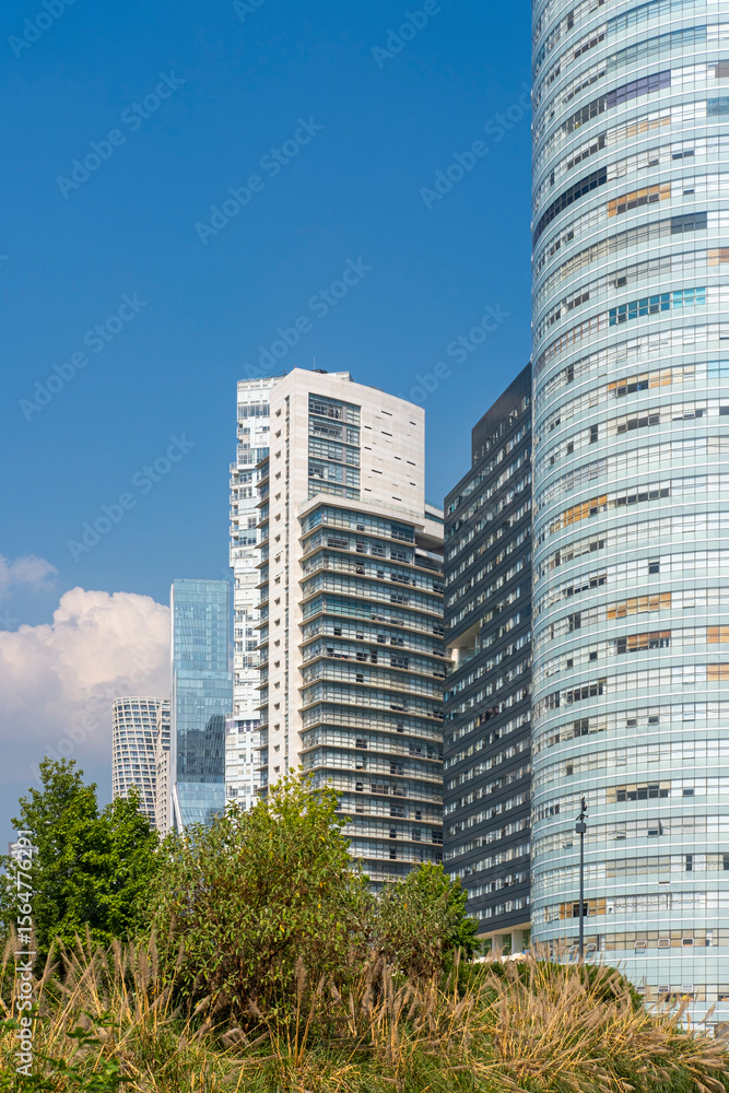 Photo Stock Urban skyline featuring modern glass towers emerging above ...