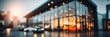 © Vlad - Car Dealership Building. Blurred Exterior Photo of Modern Business Auto Showroom
