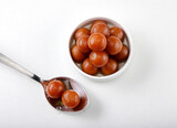 Indian most popular sweet called Gulab Jamun, isolated on white background 