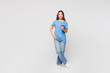 © ViDi Studio - Full body young woman she wears blue t-shirt casual clothes hold takeaway delivery craft paper brown cup coffee to go isolated on plain solid white color background studio portrait. Lifestyle concept.