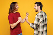 © ViDi Studio - Side view young excited overjoyed two friends buddies men they wear casual clothes together do winner gesture clench fist say yes isolated on plain yellow orange background studio. Lifestyle concept.