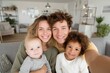 © Bundi - A young family of mixed races with small kids takes a selfie together