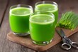 © Bundi - Two glasses are filled with juice from barley grass that was harvested fresh