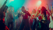 © master1305 - People dancing energetically at a vibrant night club with colorful lights. Concept of nightlife party, youth, summer, festivity, celebration