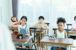 © DG PhotoStock - Young students enjoy learning a sciences in classroom.