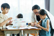 © DG PhotoStock - Young students enjoy learning a sciences in classroom.