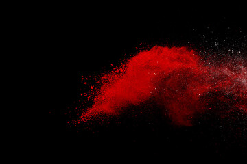Wall Mural - red powder explosion on black background. colored cloud. colorful dust explode. paint holi