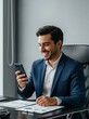 © picturehome - Smiling busy professional Hispanic business man sitting in office holding mobile cellphone. Young happy businessman entrepreneur using smartphone looking at cell phone technology at work. Vertical.