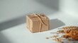 © PNG Seeker - A small brown kraft paper gift box tied with twine is isolated on a white background, next to some wheat stalks and oatmeal cookies