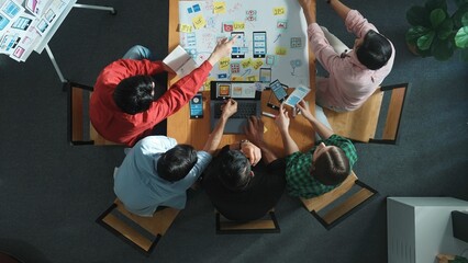 Wall Mural - top view of smart creative project manager using laptop working on ux ui design for mobile phone int