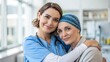 © nongnuch - World cancer day research and care concept. Compassionate caregiver embraces a cancer patient in a bright medical setting.