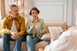 © Home-stock - Marital therapy. Senior couple consulting with professional psychologist, sitting on sofa during psychotherapy session