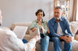 © Home-stock - Medical advisor or psychologist during home visit with senior couple. Business agent planning with retired couple their future investment opportunities