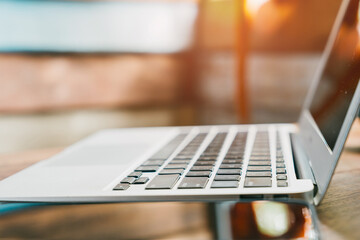 Wall Mural - close-up view of modern laptop with soft focus background for technology and office use