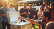 © MrLynx - Man retrieving drinks from cooler at outdoor summer party with friends