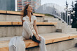 © SHOTPRIME STUDIO - happy woman in white casual outfit laughing outdoors on wooden stairs urban background fashion lifestyle spring season