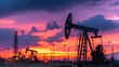 © Ginta - Silhouetted Oil Pumpjacks at Sunset