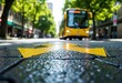 © starush - Yellow speed bump on wet asphalt street with a yellow bus approaching in the background, surrounded by green trees and urban buildings, during daytime