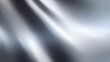 © Weiguo - Shimmering silver texture with reflective surface and soft gradient lighting for an abstract effect.