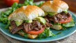 © Dreamer Studio - Roast Beef Sandwich with Lettuce, Tomato, and Avocado on Soft Bun