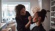 © PACHARA - A woman is getting her makeup done by another woman
