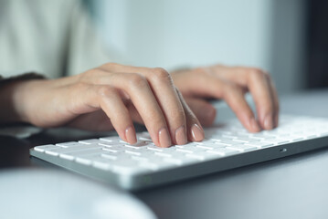 Wall Mural - closeup, business woman hand typing on desktop computer keyboard, online working, searching the info