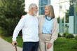 © New Africa - Lovely senior couple walking together near building outdoors