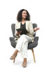 © New Africa - Professional psychologist with clipboard in armchair on white background