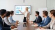 © creativestock - Woman presenting data on screen to colleagues in a modern office meeting room setting with table