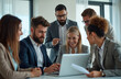 © Vadym - Business team meeting in modern office boardroom. Diverse group of people working on laptop. Teamwork, planning, collaboration, ideas, review, proposal, discussing project.