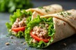 © Vadym - Close-up photo fresh tuna wraps. Healthy lunch with tomatoes and lettuce, wrapped tortilla. Cookery, healthy meal, dining. Appetizing, delicious food, perfect for lunch break.