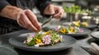 © Adel - Chef plating gourmet food with edible flowers culinary art fine dining restaurant food presentation plate