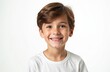 © Vadym - Happy young boy looks at camera. Smiling kid with brown hair and white t-shirt. Cheerful expression and positive face on white background. Perfect for advertising kids products.