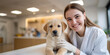 © Old Man Stocker - Smiling Young Woman in Lab Coat Holding Cute Puppy at Veterinary Clinic with Bright Modern Interior and Friendly Atmosphere