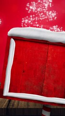 Wall Mural - animation of road sign with copy space over snow falling and glowing spots on red background