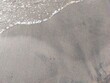 © Oyan - The foam of small waves washing over the sand looks very beautiful