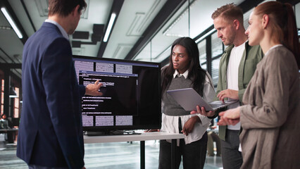 Wall Mural - innovative developer guides team through coding presentation