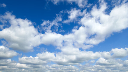 Wall Mural - a beautiful blue sky with soft, white clouds, for an abstract background