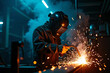© Jelly - Close-up of industrial welder at work creating bright electric sparks while fusing metal in a modern fabrication workshop with protective gear, cinematic lighting, and intense manual precision