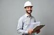 © Pete - Smiling young unshaven businessman wearing white construction helmet, light shirt holds clipboard with papers. Isolated on grey background, image represents career achievement, wealth, business