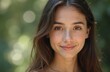 © Pete - Portrait of beautiful young woman with clear skin, natural look. Smiling gently, brown hair, brown eyes, conveying sense of calm, confidence. Natural beauty shines in close-up shot against blurred