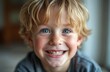 © Pete - Portrait of happy young Caucasian boy with blond hair, blue eyes smiling widely. Cute face with freckles. Background blurred, emphasizing child joyful expression. Perfect for back to school themes