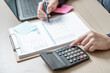 © Garun Studios - Financial business analysis. Account management. Accounting finance calculator. Accountant analysis money budget. Accountant working concept.