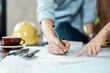 © Garun Studios - Architect engineer office concept. Architecture engineering plan. Construction plans.