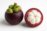 Whole and Halved Mangosteen Displayed on White Surface
