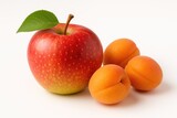 Juicy apple and apricots displayed on a white background