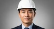© Tetiana - Asian male engineer in suit and white hard hat with confident expression