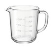 © studioworkstock - Glass measuring cup with a spout and clear markings, useful for heating liquids in a home kitchen.