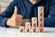 © Samoresh - A man shows a thumbs up from a success graph. Successful investments, income and economic development concepts. Optimistic forecast. Entrepreneurship.
