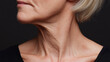 © Marut - Close up of elderly person neck and lower face showing natural wrinkles and stretched skin with visible lymph node area, highlighting aging skin texture and detail